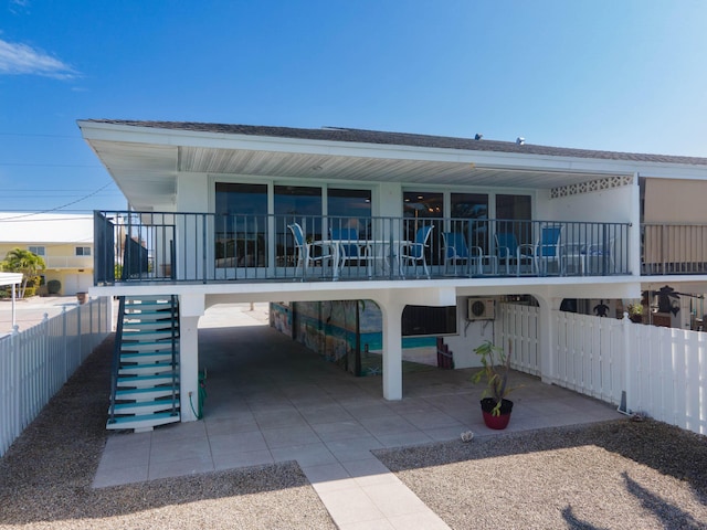 rear view of property featuring a carport