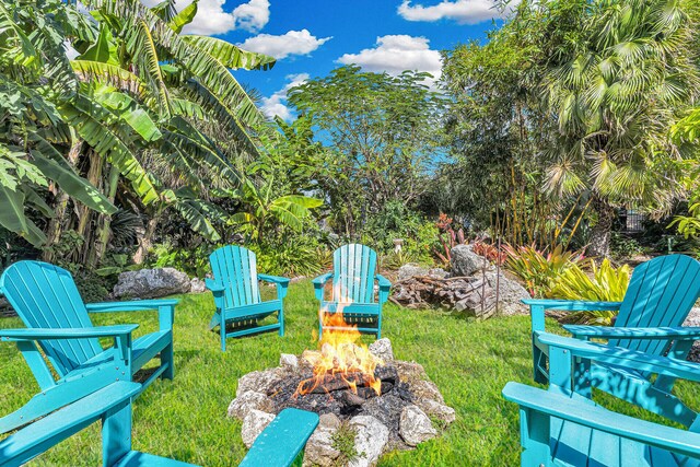 view of yard with an outdoor fire pit