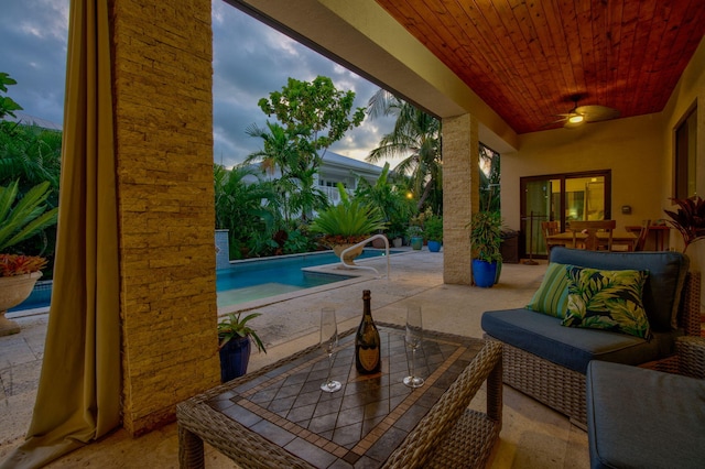 patio terrace at dusk with ceiling fan