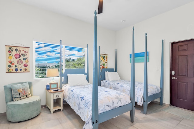 bedroom with light tile patterned floors