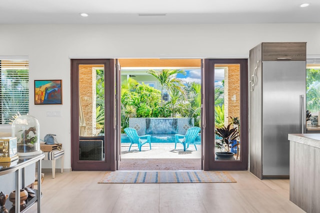 doorway featuring light tile patterned floors