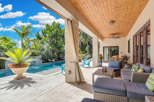 view of patio with pool water feature, outdoor lounge area, and ceiling fan