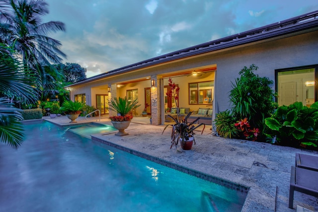 view of swimming pool with a patio