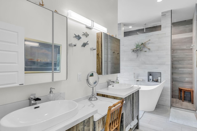 bathroom featuring vanity and shower with separate bathtub