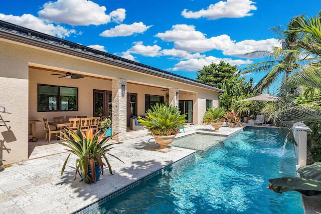 view of swimming pool featuring a patio, pool water feature, and ceiling fan