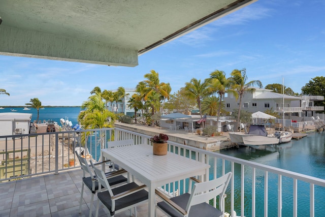 balcony featuring a water view