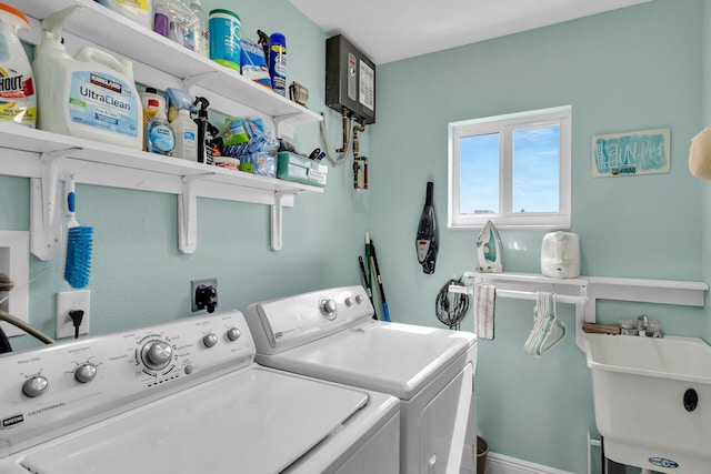 laundry area with sink and washer and dryer