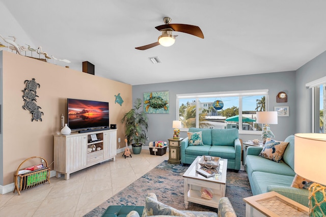 tiled living room with ceiling fan