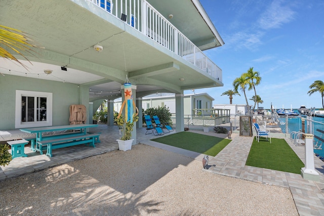 view of patio featuring a water view