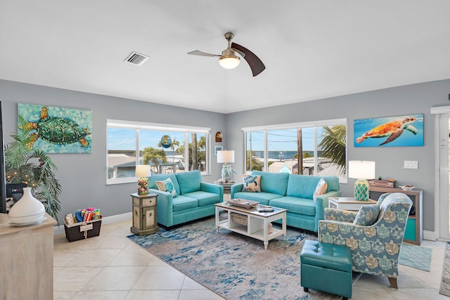 living room featuring light tile patterned flooring and ceiling fan