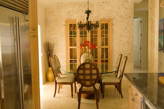 dining area featuring an inviting chandelier