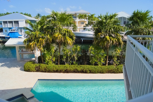 view of pool with a water view