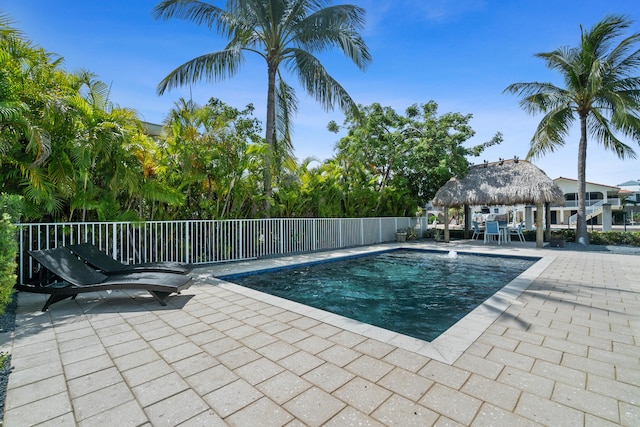 view of swimming pool with a gazebo and a patio area