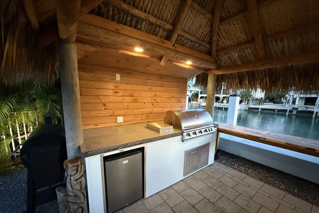 view of patio featuring a grill and an outdoor kitchen