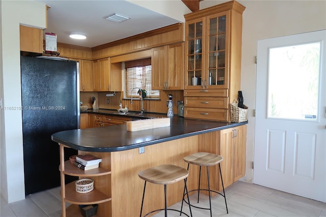 213 Aberdeen Ct, Key Largo, FL 33070 - kitchen featuring freestanding refrigerator, open shelves, dark countertops, and a peninsula