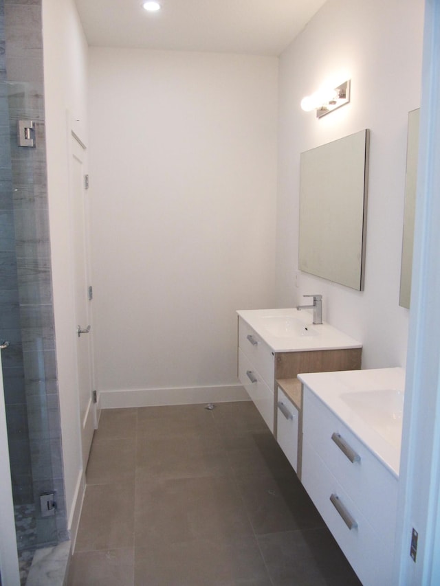 bathroom with walk in shower and vanity