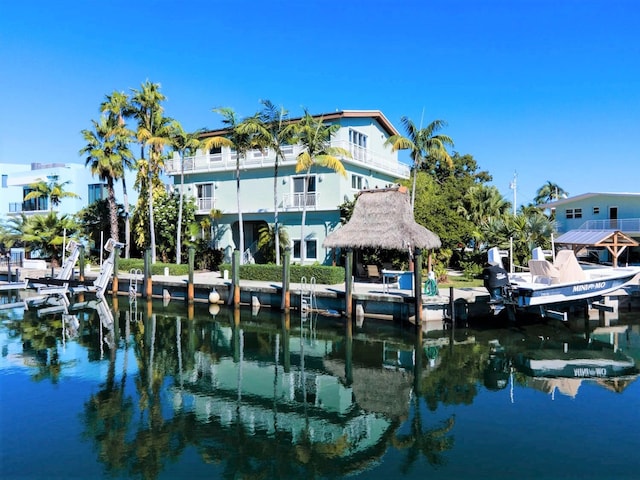 view of dock featuring a gazebo and a water view