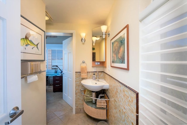 bathroom with tile patterned flooring and sink