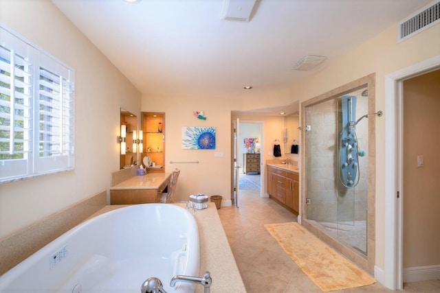 bathroom featuring vanity, tile patterned flooring, and shower with separate bathtub