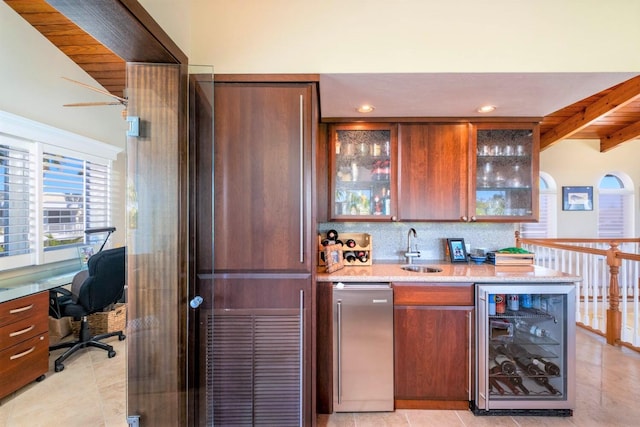 bar featuring sink, beverage cooler, decorative backsplash, fridge, and light tile patterned floors