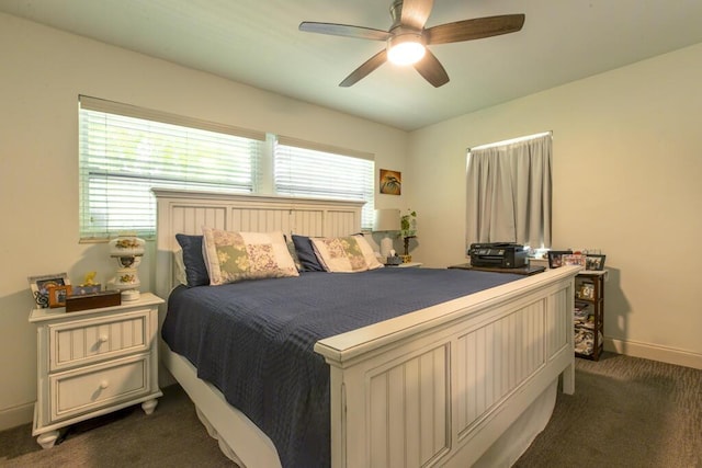 2910 Fogarty Ave, Key West, FL 33040 - bedroom with baseboards, dark carpet, and a ceiling fan