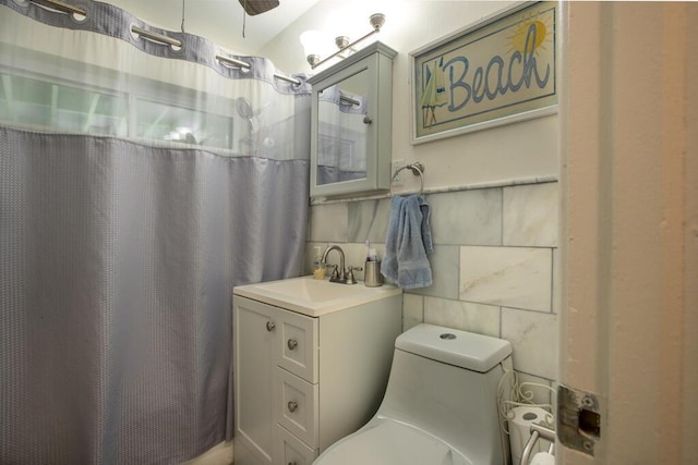 2910 Fogarty Ave, Key West, FL 33040 - bathroom featuring tile walls, curtained shower, toilet, and vanity