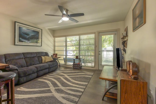 2910 Fogarty Ave, Key West, FL 33040 - living area with a wealth of natural light, a ceiling fan, and concrete flooring