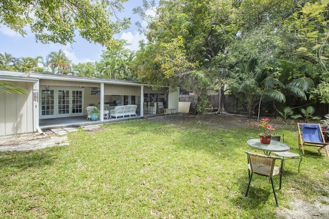 2910 Fogarty Ave, Key West, FL 33040 - view of yard with fence, french doors, and a patio area