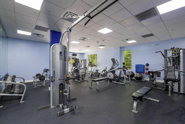 workout area featuring a paneled ceiling