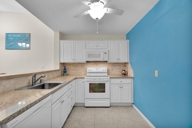 kitchen with white cabinetry, sink, white appliances, and backsplash