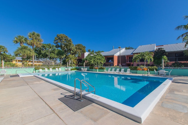 view of swimming pool featuring a patio