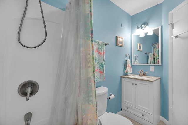 bathroom featuring vanity, toilet, and a shower with shower curtain