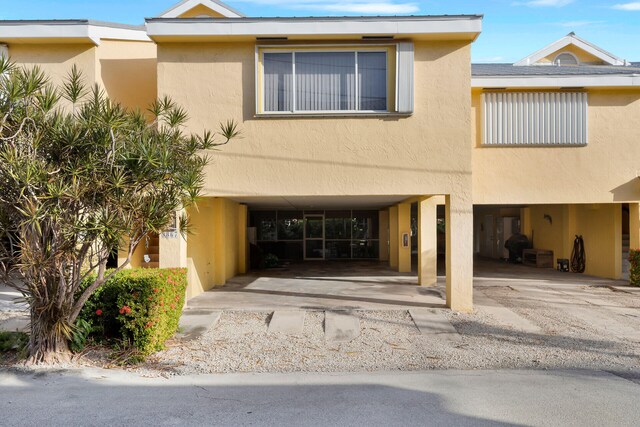 exterior space with a carport