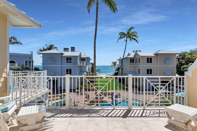 balcony featuring a water view