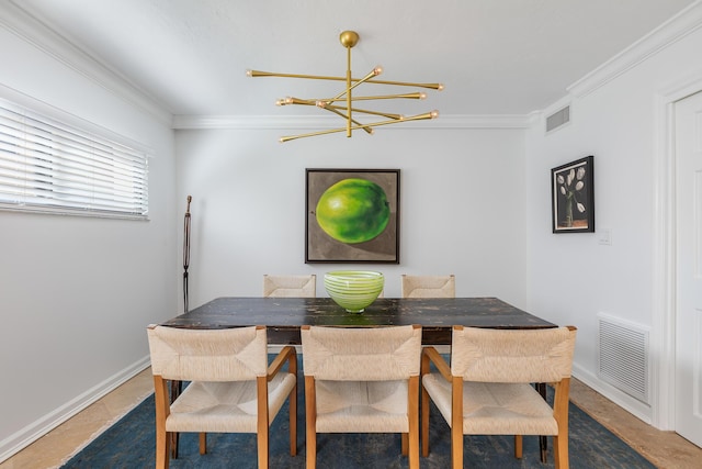 dining space featuring ornamental molding and a notable chandelier