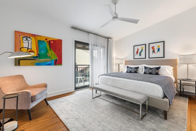 bedroom featuring access to exterior, vaulted ceiling, wood-type flooring, and ceiling fan