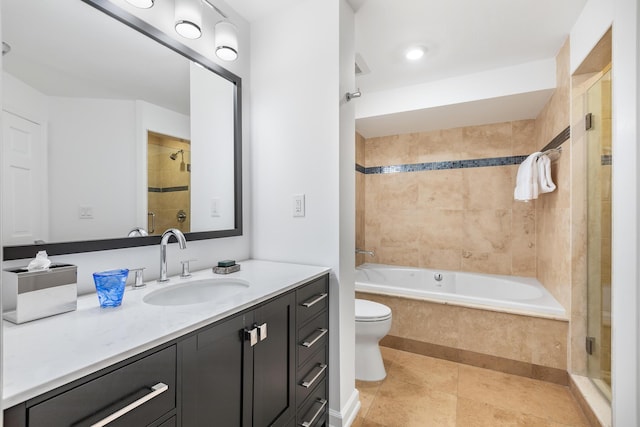 bathroom featuring walk in shower, vanity, tile patterned floors, and toilet