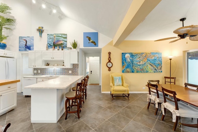 33 Pen Key Dr, Islamorada, FL 33036 - kitchen with white cabinetry, white appliances, decorative backsplash, and hanging light fixtures