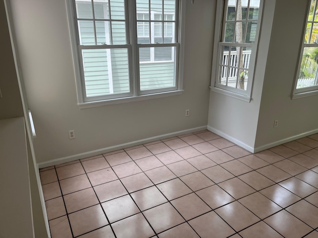 8 Kestral Way, Key West, FL 33040 - spare room with light tile patterned floors and baseboards
