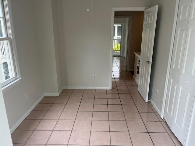 8 Kestral Way, Key West, FL 33040 - empty room with light tile patterned floors and baseboards