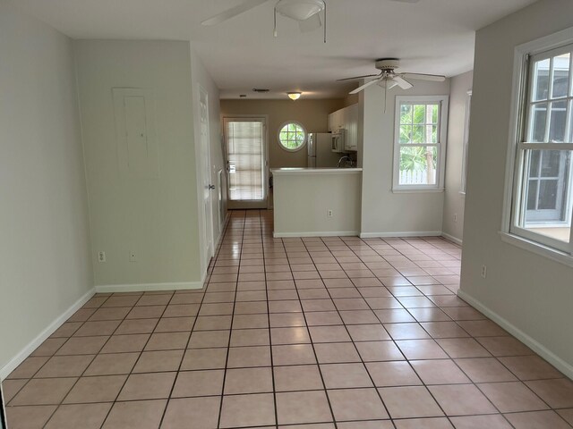 8 Kestral Way, Key West, FL 33040 - unfurnished living room with ceiling fan and light tile patterned flooring