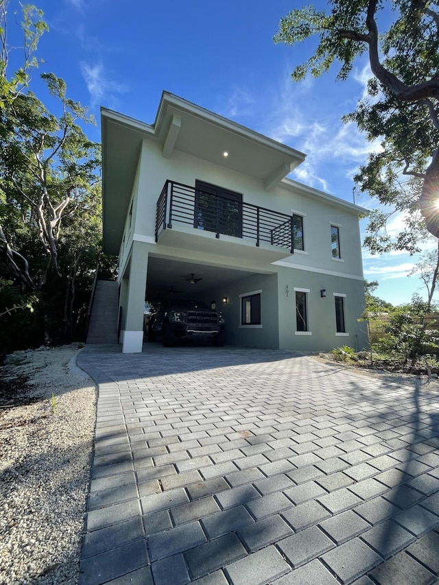 rear view of house featuring a balcony