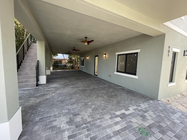 view of patio featuring ceiling fan