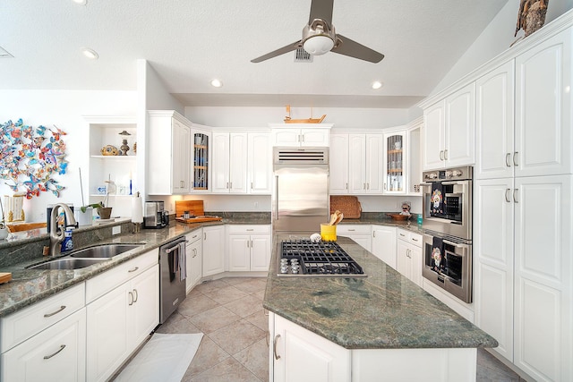 kitchen featuring stainless steel appliances, sink, and white cabinets