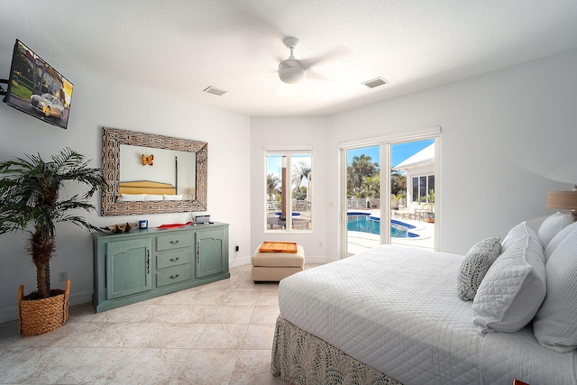 tiled bedroom featuring ceiling fan, a textured ceiling, and access to outside