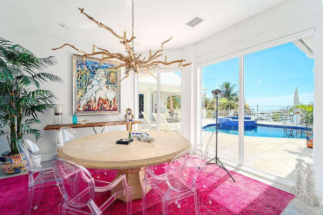 dining space with a chandelier