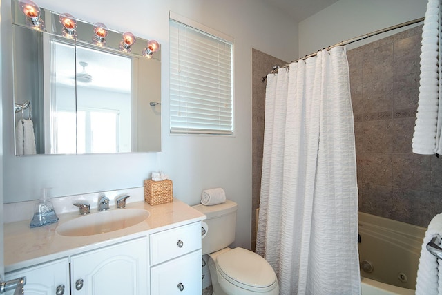 full bathroom featuring vanity, shower / tub combo with curtain, and toilet