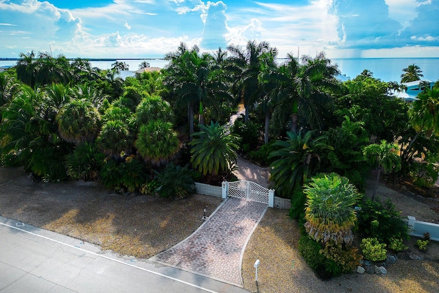 birds eye view of property with a water view