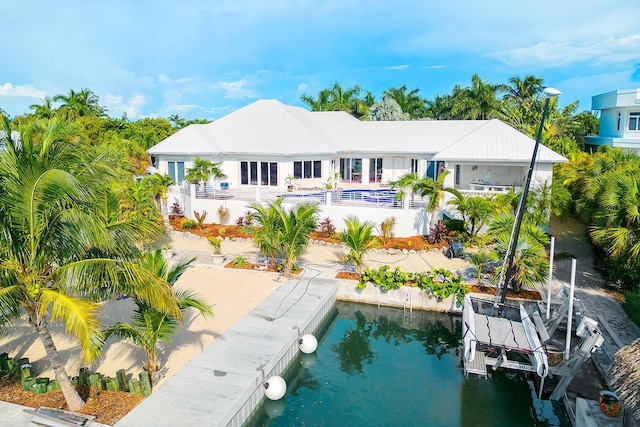 back of house featuring a water view