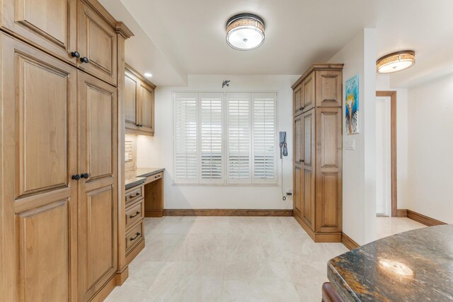 kitchen with dark stone countertops